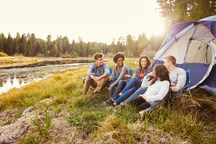 a group of people sitting in a tent