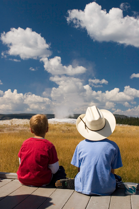 a group of people standing around a plane