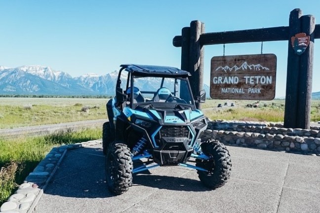 a truck with a mountain in the background