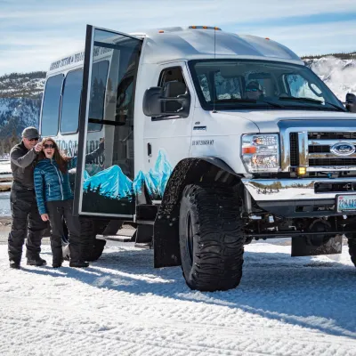 a truck is parked in the snow