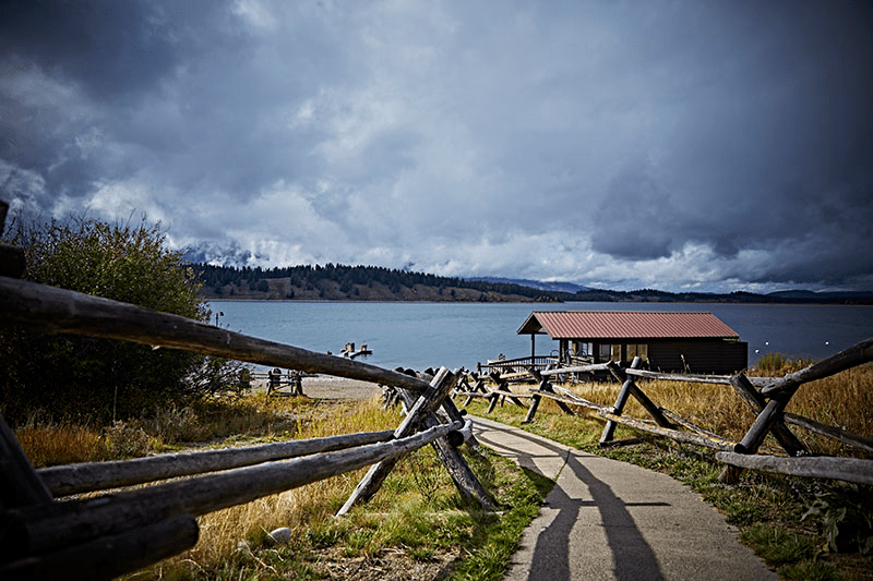 a bench next to a body of water