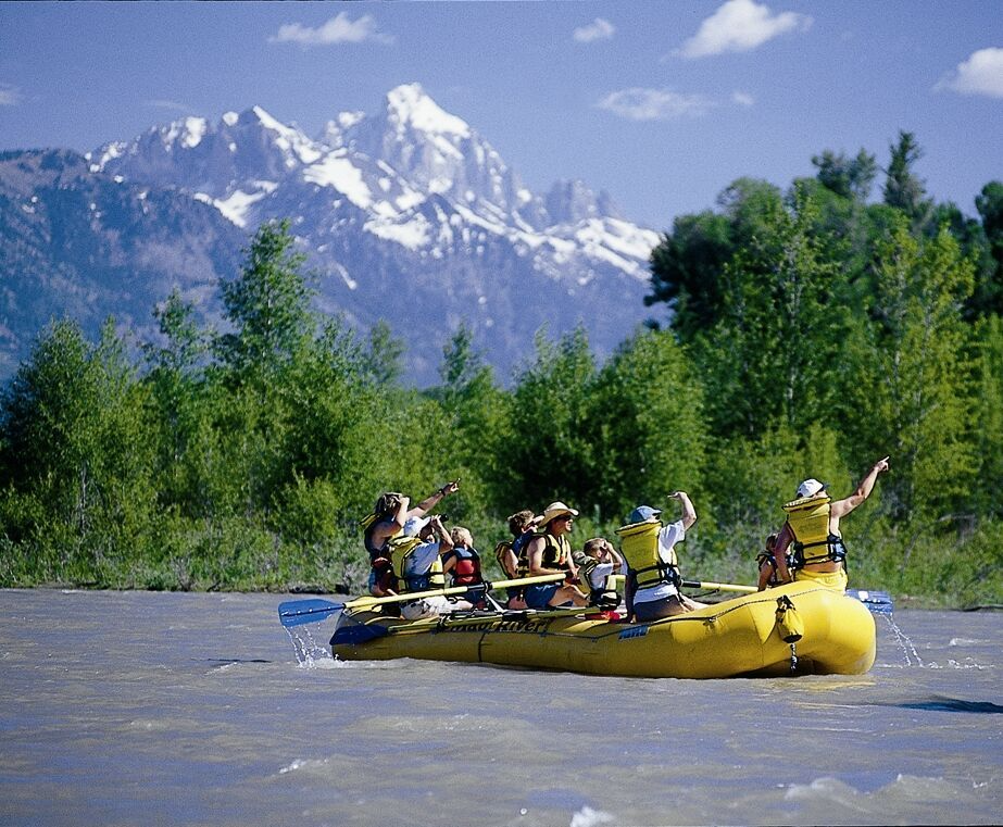 e92bfaebe617625 a group of people riding on the back of a boat