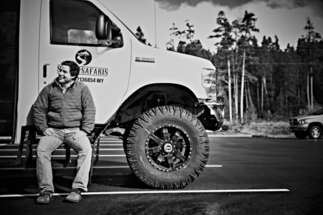 a man riding on the back of a truck