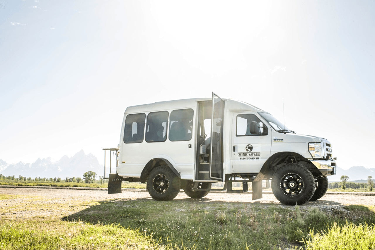 a truck is parked in the grass