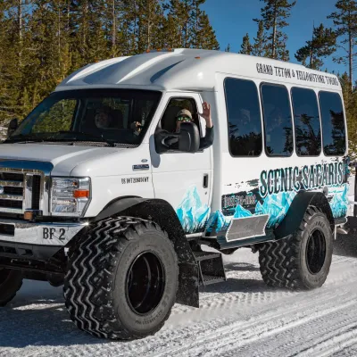 a truck driving down a dirt road