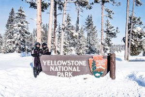 a man jumping in the air doing a trick on a snow board
